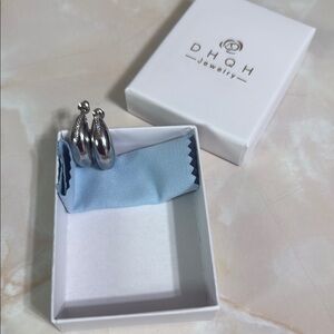 DHQH Fashion Jewelry silvertone half moon shape pierced earrings with CZ design